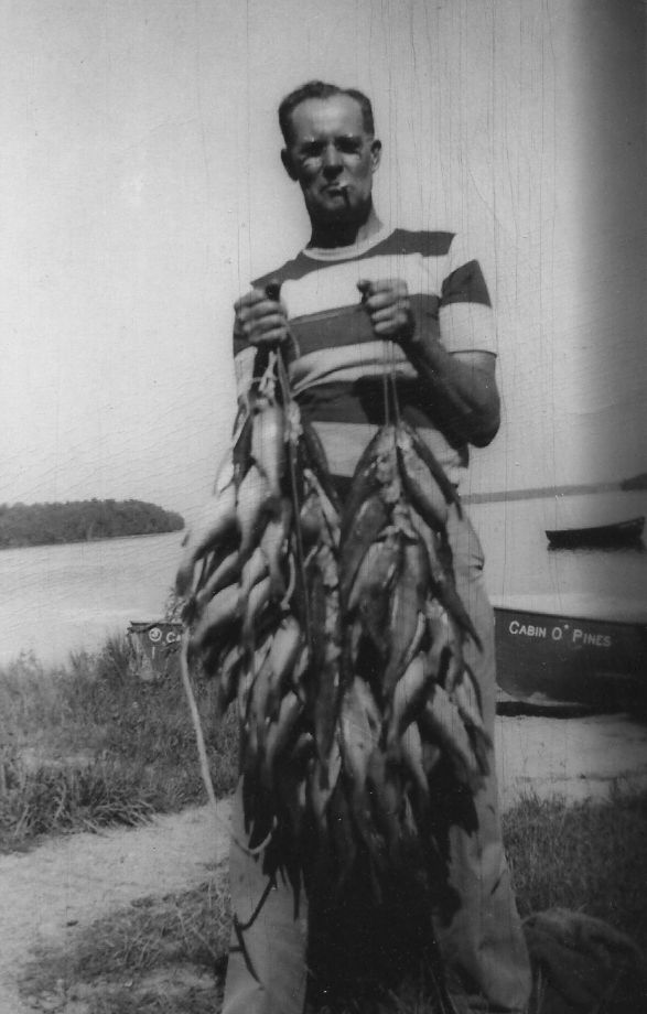 Cabin O' Pines Guest with a great catch after taking a wooden boat out for the day!