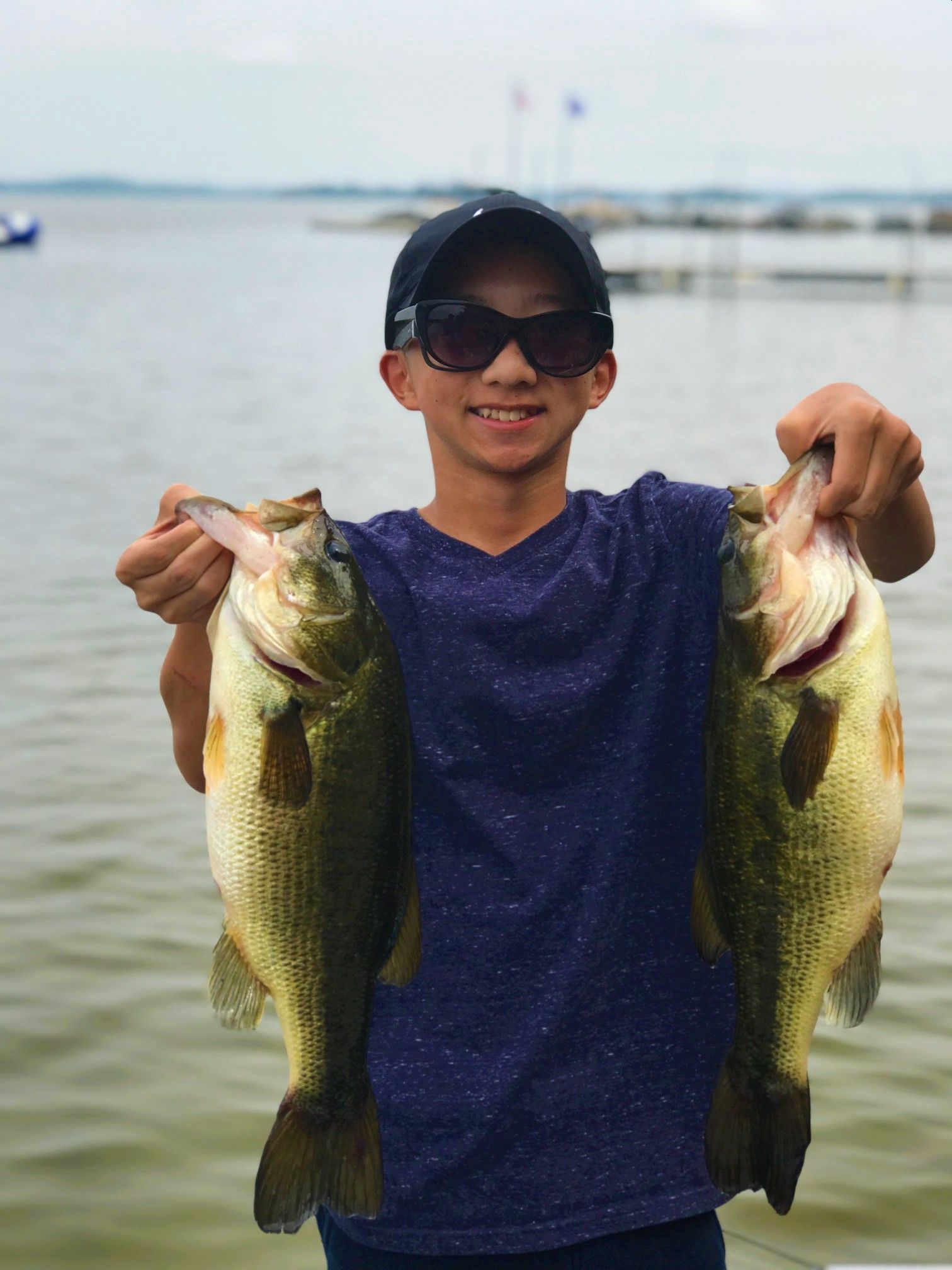 Two Bass Caught Off The Dock