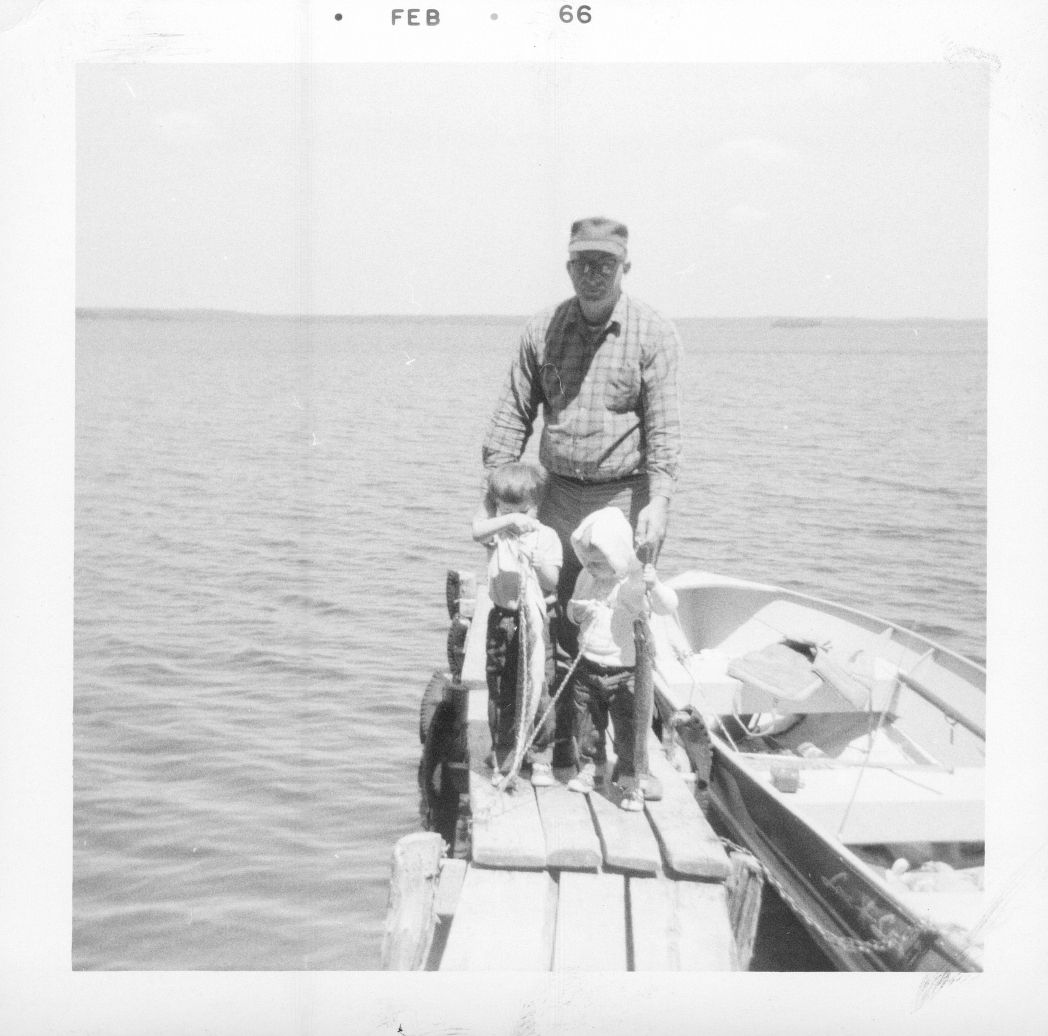 Cabin O Pines Guest, Don VanZant, with his two sons in February 1966 on the then main dock at Cabin O' Pines, Pelican Lake, MN.
