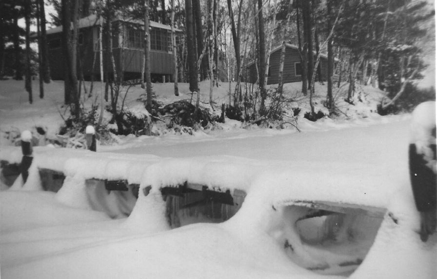 Mid-1950s - Frozen dock with (left to right) Norway Pine (Cabin #4) and Twin Pines (Cabin #3) in the background.