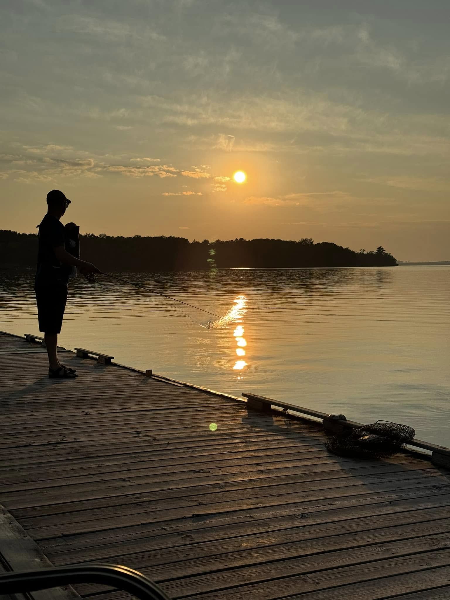 Chief Meteorologist Adam Lorch with daughter on Main Dock at Cabin O' Pines Resort, Orr, MN - Summer 2024